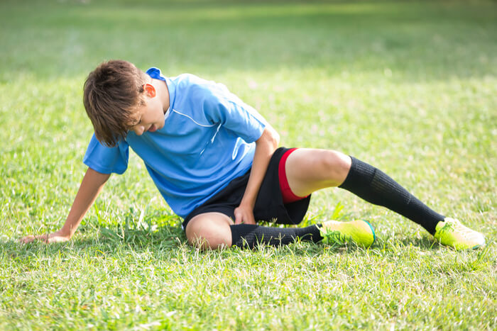 Child athlete injured on the ground