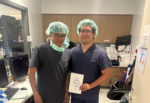 Drs Trinidad and Desai holding a Barostim sign